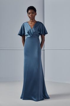 The V-neck front mimics a wrap dress, but comes together at the natural waist, flowing into an A-line skirt in fluid satin. Loose sleeves are airy enough for summer but transition the style seamlessly into fall and winter weddings. Shown in Navy and Petrol. Amsale Bridesmaid Dresses, Bridesmaids Gown, Amsale Bridesmaid, Dress With Kimono, Amsale Dress, Jenny Yoo Bridesmaid, Petrol Price, Wrap Front Dress, Bella Bridesmaid