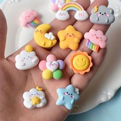 a person's hand is full of small toy magnets