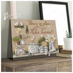 there's no place like home sign with flowers and kitchen items on the table