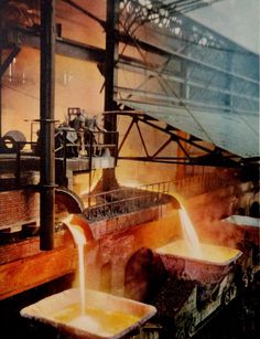 an industrial factory filled with lots of yellow liquid pouring out of large metal containers on top of each other