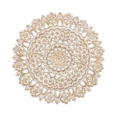 a white doily with an intricate design on it