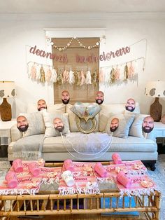 a living room filled with lots of pillows and blankets on top of a wooden coffee table