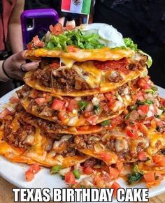 a stack of taco cake sitting on top of a white plate