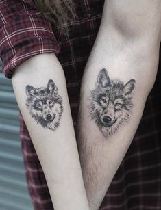 two people with matching tattoos on their arms