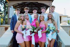 a group of young people standing next to each other in front of a gazebo