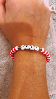 Super cute and preppy Christmas bracelet!! Never used, (except to model) wait to be bought!! Preppy Bracelet Ideas With Words, Xmas Bracelet Ideas, Playful Red Stretch Bracelet For Gift, Fun Red Bracelet Gift, Fun Red Bracelet For Gift, Cute Red Stretch Bracelet For Friendship, Cute Red Friendship Stretch Bracelet, Cute Christmas Holiday Jewelry, White Letter Beads Bracelets For Holidays