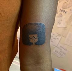 a person with a tattoo on their arm has an image of a woman's head