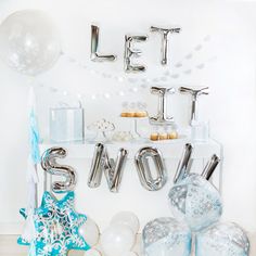 a snow themed birthday party with balloons and decorations