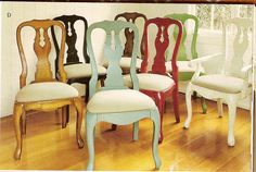 there are many different chairs in the room with wood flooring and white walls behind them