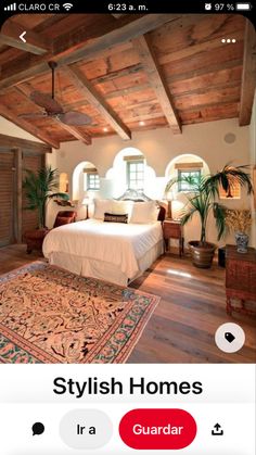 a bedroom with wood floors and white bedding in an old - fashioned style house