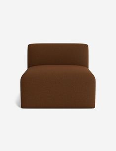 a brown couch sitting on top of a white floor