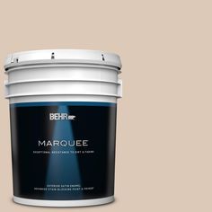 a bucket of behr marquee on a blue background