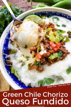 a blue and white bowl filled with green chile chorizo quesadilla