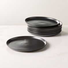 black plates stacked on top of each other