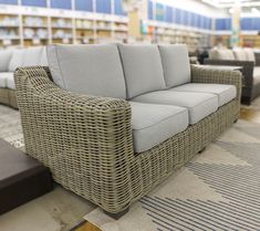 wicker couches and tables in a store