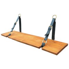 a wooden shelf with two straps hanging from it's sides and one on the other side