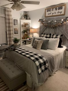 a bedroom with a large bed and plaid comforter