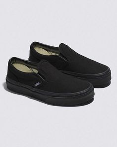 Kids Slip-On Shoe Vans Slip-ons With Rubber Sole For Streetwear, Black Slip-ons With Vulcanized Sole For Streetwear, Black Sporty Slip-ons With Rubber Sole, Black Skate Shoes With Rubber Waffle Outsoles, Black Skate Shoes With Rubber Heel Cap, Classic Slip-ons With Vulcanized Sole For Streetwear, Casual Black Skate Shoes With Rubber Toe Cap, Black Casual Skate Shoes With Rubber Toe Cap, Black Low-top Slip-ons With Vulcanized Sole