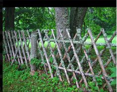 an old wooden fence with moss growing on it