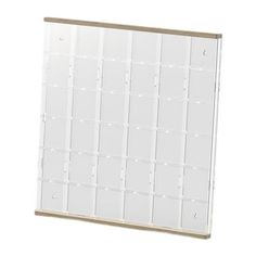 a white wall mounted calendar with numbers on it