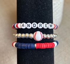 three different bracelets with baseball beads on them