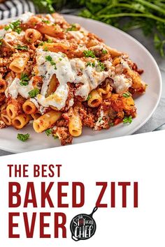 the best baked ziti ever is served on a white plate with parmesan cheese