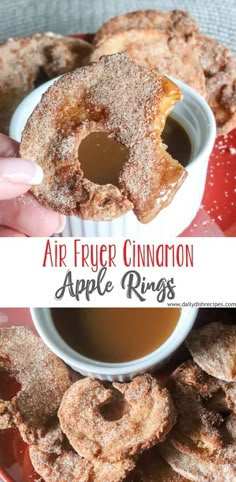 an apple ring is being dunked into a cup of tea with cinnamon on the side