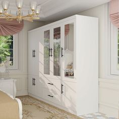 a bedroom with white furniture and pink curtains