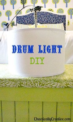 a drum light that is sitting on top of a bed with the words drum light diy printed on it