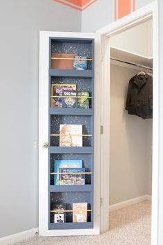 an open closet with books and magazines in it