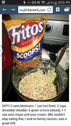 a bowl of food sitting on top of a stove next to a bag of chips