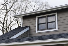 the roof of a house with two windows