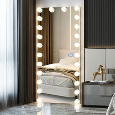 a bedroom with a large mirror and lights on the wall