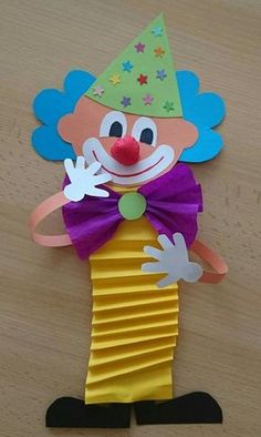 a clown made out of construction paper on a table