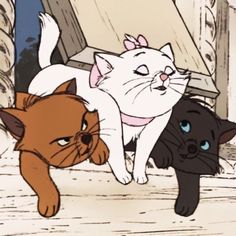 three cartoon cats and one cat laying on the ground