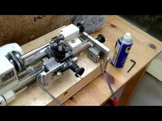 a machine that is sitting on top of a wooden table next to a spray bottle