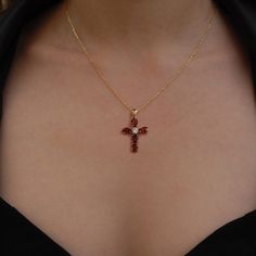 "This garnet cross necklace is a beautiful and meaningful piece for those who practice Christianity. The solid gold pendant features a small, elegant cross adorned with a sparkling garnet gemstone. The necklace is a minimalist and modern design, making it suitable for everyday wear. The garnet, a deep red stone, adds a pop of color to the necklace. The rich red hue of the pendant captures the festive spirit of the holiday season, making it a perfect symbol of love and celebration to share with your special someone during Christmas. PRODUCT DETAILS: * Material: 14K Solid Gold (real solid gold, no gold-filled or no gold plated material) * Choice of Gold Color: Yellow Gold, Rose Gold, White Gold * Adjustable gold extension chain * Closure: Spring ring * Chain style: Cable * Style: Minimalist Stone Cross Necklace, Christian Cross Necklace Aesthetic, Red Cross Pendant Necklace For Gift, Red Cross Pendant Necklace Gift, Elegant Gemstone Crucifix Necklace, Elegant Crucifix Gemstone Necklace, Gemstone Pendant Cross Necklace For Gift, Gemstone Crucifix Jewelry For Gift, Elegant Gemstone Cross Necklace