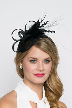 "\"Arianna\" Black Fascinator This season, sophisticated fascinators stole the show on the runways. Fascinators can be a little intimidating. But this cute little fascinator will help you overcome that fear. It perfectly lands the look, thanks to its mesh sinamay, frilly feathers, and loopy mesh ribbons. No matter the occasion, you will fit in with the fascinator craze with this simple yet stylish head-piece. Add Men's Matching Bow Tie: Don't you dare get caught mismatching your sweetie's favori