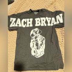 This Was Actually A Misprint - It Was Advertised As A Grey Shirt And They Sent Out Black, So You Can’t Get This Anywhere! Only Worn A Handful Of Times. Thick Material And Slightly Oversized. Men Or Women’s. Open To Offers :) Zach Bryan Clothes, Zach Bryan Shirt, Zach Bryan, Grey Shirt, Christmas Wishlist, Womens Tops, Tops & Tees, Concert, Grey