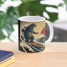 a coffee mug with an image of a godzilla riding a surfboard on a wave