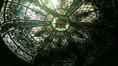 the inside of a circular glass window with beads on it