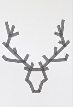 an image of a reindeer made out of duct tape on the wall and in front of it