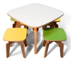 four chairs and a table are shown in three different color options, one is yellow, the other is green