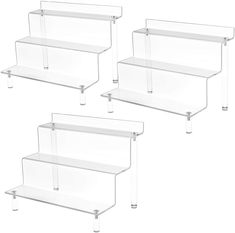 four clear plastic shelves with metal legs on each side and one shelf above the other