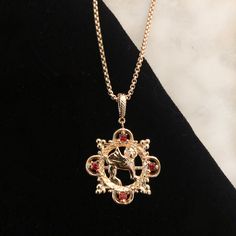 This past summer we visited Musee Cluny in Paris as part of our middle ages research and happened upon a gorgeous griffon from 1000AD. We Recreated it as a necklace and added some ruby red stones for added regal flair. Team Gryffindor? Brass plated in 18K gold with ruby red cubic zirconia stones. 16" chain with 3" extension for additional length. All orders over $50 ship for free within the USA. All orders usually ship within 24 hours from the USA. Griffon Aesthetic, Gryffindor Accessories, Gryffindor Necklace, Slytherin Necklace, Ahs Style, Gryffindor Aesthetic, Yule Ball, Red Stones, Harry Potter Gryffindor