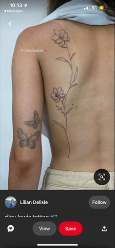 the back of a woman's body with tattoos on it