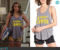 the young woman is wearing this grey tank top with happy camper written on it