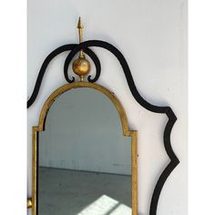 a mirror hanging on the side of a wall