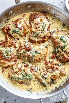 chicken with spinach and cheese in a skillet