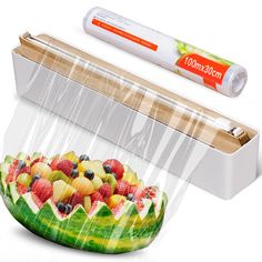 a plastic container filled with fruit next to a pencil and marker on a white background